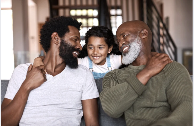 Shot of an adorable little girl spending time with her father and grandfather at home